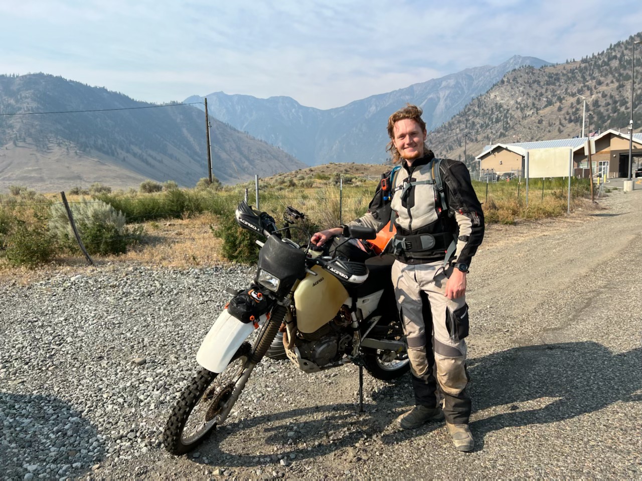 Posing at the Canadian border with my trusty steed, silently hoping and praying that the bike’s engine wouldn’t grenade itself halfway through the trip.